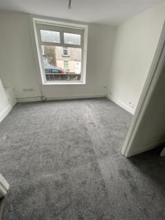 Bright bedroom with fresh grey carpeting...