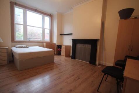 Bright, spacious bedroom with large windows...