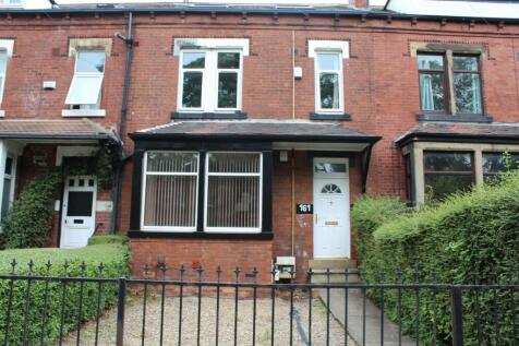 A charming brick-fronted house with a welcoming...