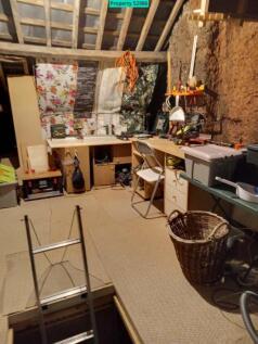 Boarded loft area, currently being used as a work 