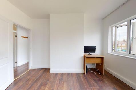 Bright room with large window and study desk...