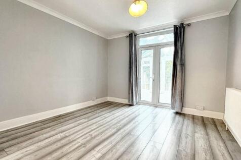 Bright spacious room with French patio doors...