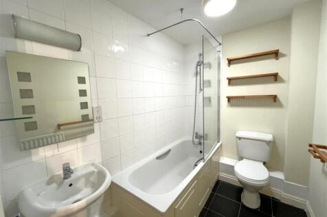 Bathroom with shower over bath