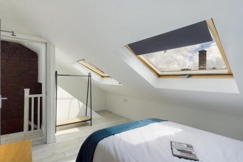 A spacious and bright large double bedroom with...