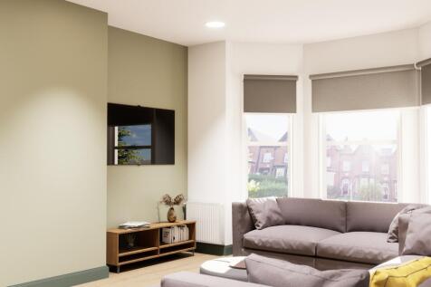 Bright lounge with bay windows and wall-mounted...