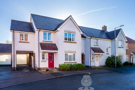 Front View with Carport and Garage