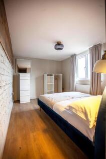 Bright furnished bedroom with stylish decor...