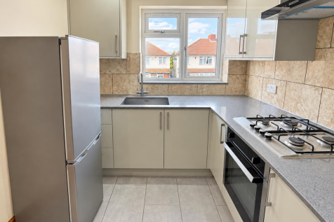 Clean, bright estate kitchen.png