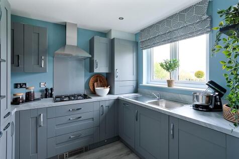 Three sided kitchen with ample storage