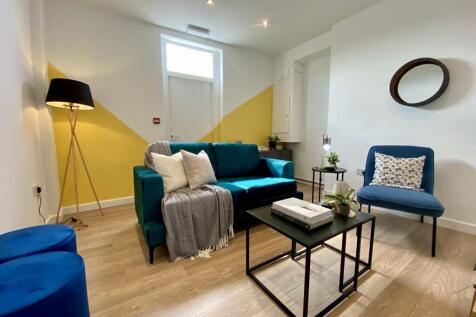 Bright and inviting living room featuring a sty...