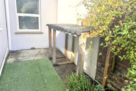 Private courtyard garden with sheltered bike st...