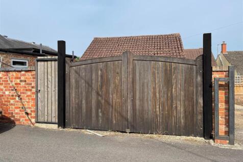 Gates at rear from College St.