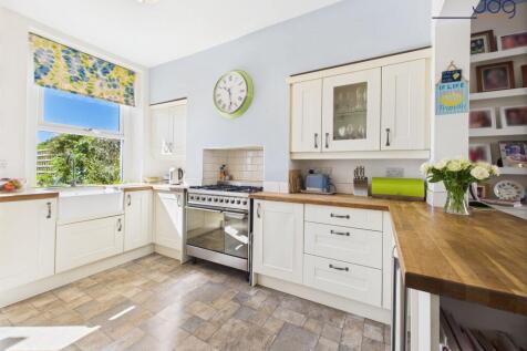 Shaker style kitchen with solid wooden worksurfaces and belfast sink