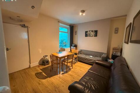 Social living area with ample seating and table...