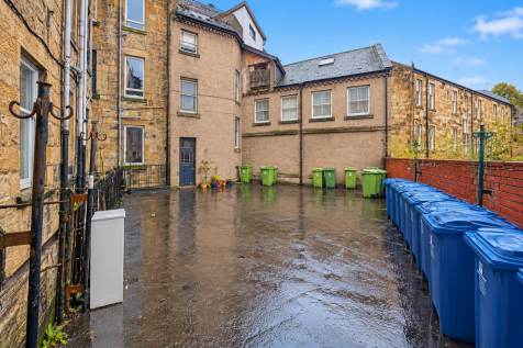 Rain-Glossed Residential Courtyard.png