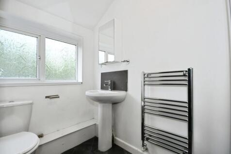 Bright modern bathroom with heated towel rail...