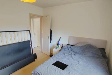 Bright, airy bedroom with a comfortable bed...