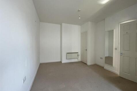 Bright and spacious bedroom with neutral decor...
