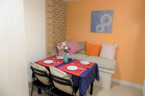 Bright, cosy communal lounge corner with a cush...