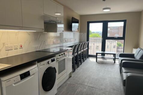 Modern, well-lit living area with ample natural...