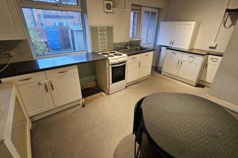 Bright kitchen with ample workspace and dining....