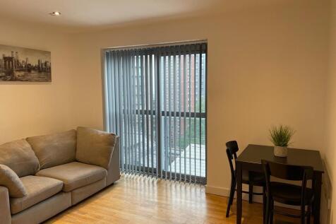 Bright modern lounge with comfy sofa and dining...