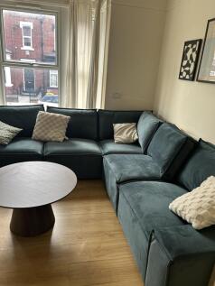 Stylish corner sofa and chic wood flooring...