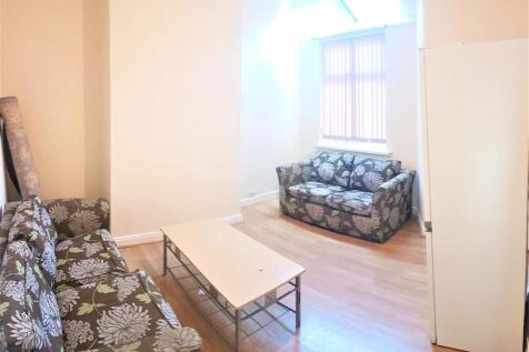 Bright furnished living room with matching flor...