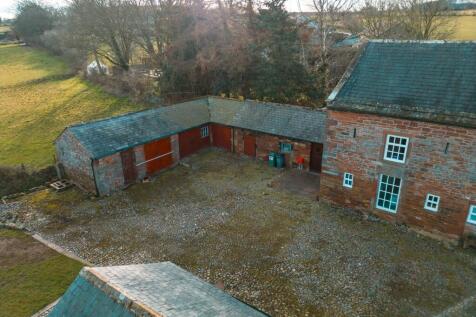 Cobbled Courtyard with access into Orchard Cottage and 4 outbuildings