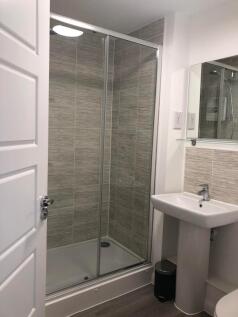 A modern and clean bathroom featuring a spaciou...