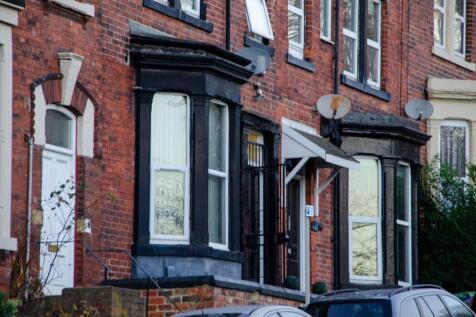 Charming brick exterior with classic bay window...