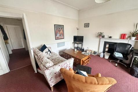 Bright and cozy lounge area with character....