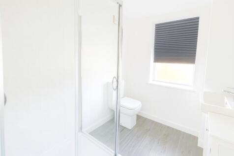 Bright and clean bathroom featuring a modern to...