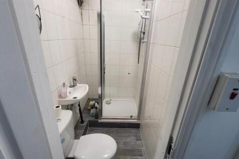 Modern bathroom with sleek glass shower enclosu...