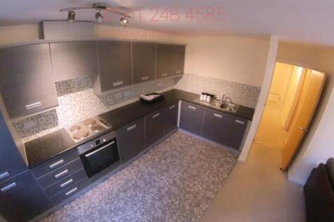 Modern galley kitchen with integrated oven, sle...