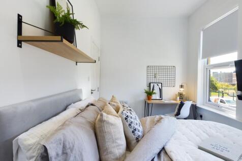 A spacious and inviting large double bedroom fi...
