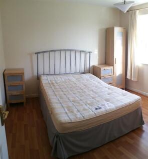 Bright, tidy bedroom with a double bed, matchin...