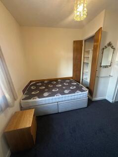 Bright, simply furnished double bedroom with a ...