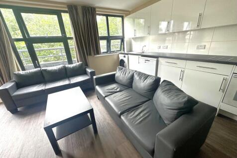 Bright open-plan living area with large windows...