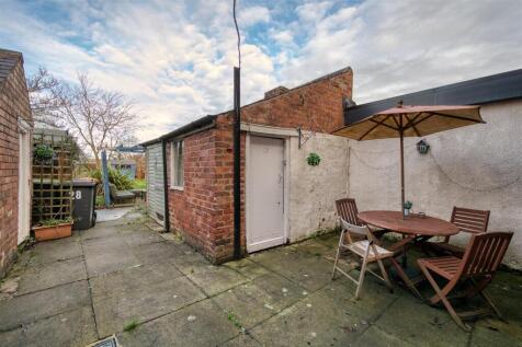 Garden - dining patio and outhouse.jpg