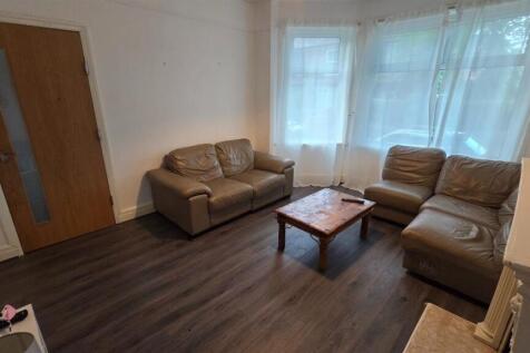Bright, well-presented living room with large f...
