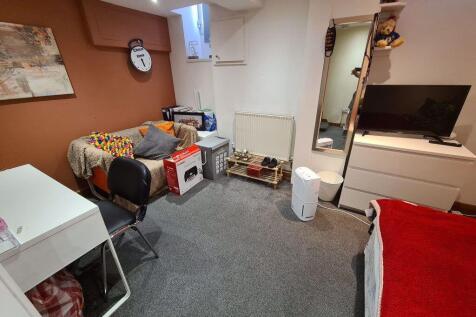 A neat and functional small room featuring a co...