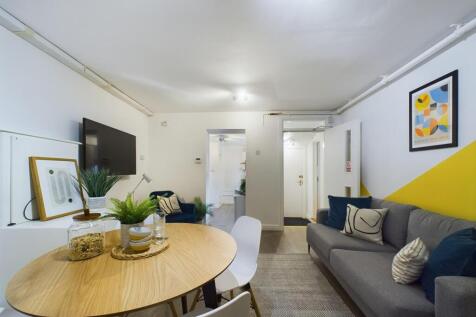A contemporary and inviting living room featuri...