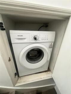 Convenient laundry area with modern appliances...