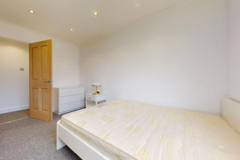 Bright modern bedroom with ample floor space...
