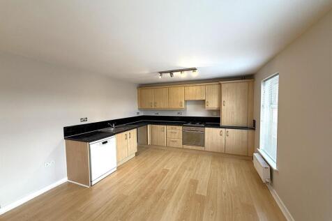 Spacious modern kitchen with sleek cabinetry....