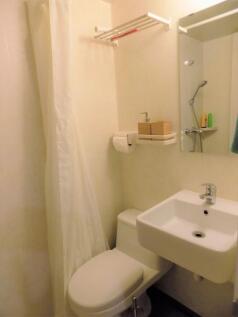 Compact, well-kept bathroom with a modern sink,...