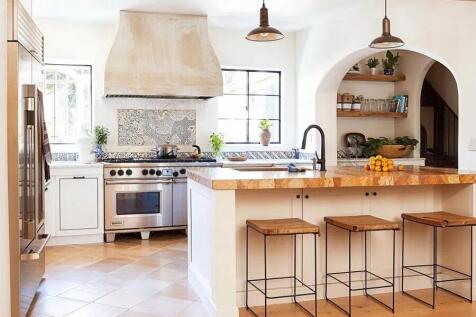 Bright and welcoming kitchen with modern applia...