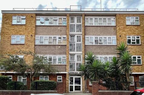 Clean mid-century apartment block with brick an...