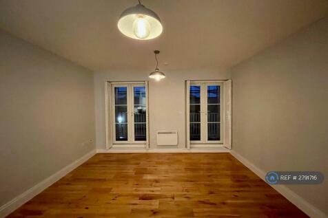Open Plan Lounge With Balcony Doors